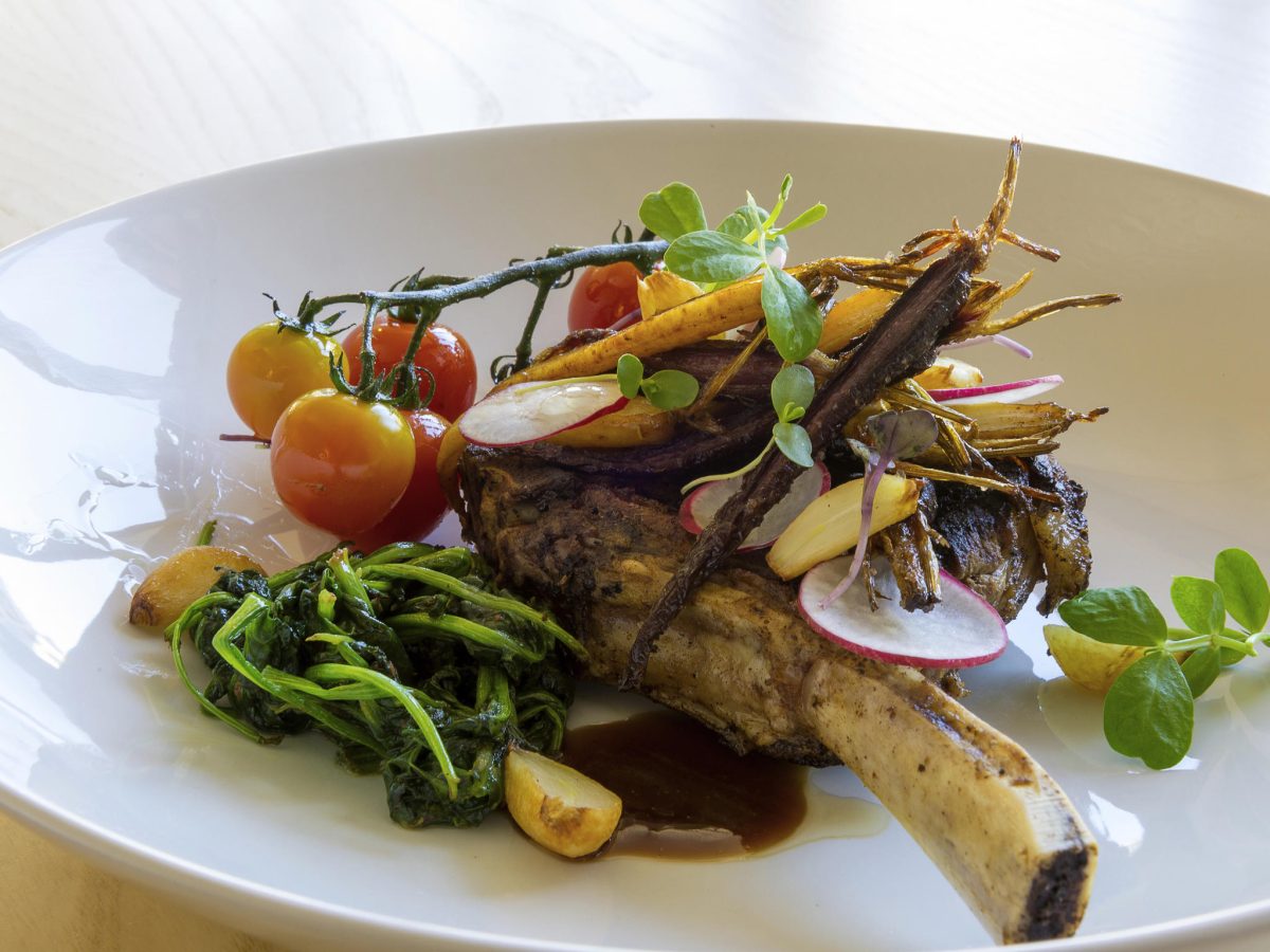 Lamb Shank garnished with vegetables and garnish